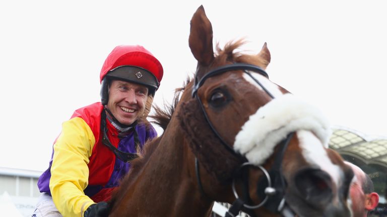 Richard Johnson on Native River celebrates after winning the Timico Cheltenham Gold Cup Chase at the Cheltenham Festival