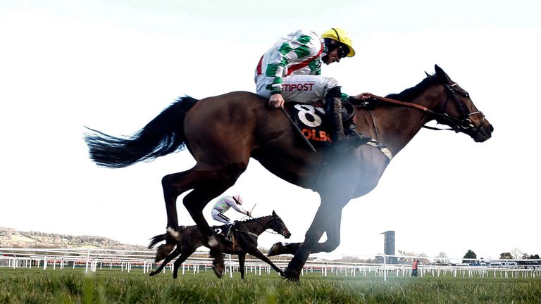 Ruby Walsh riding Benie Des Dieux (farside) wins The OLBG Mares' Hurdle Race from Midnight Tour on Champion Day at Cheltenham Festival