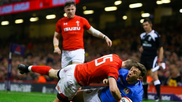 Liam Williams (15) was yellow-carded for this tackle on Italy full-back Matteo Minozzi