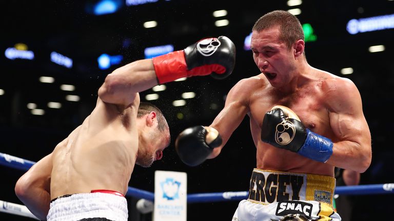 Sergey Lipinets punches Akihiro Kondo during their IBF junior welterweight title bout at the Barclays Center on November 4, 2017 in the Brooklyn Borough of  New York City.