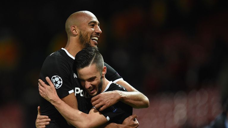 Steven N'Zonzi celebrates with Pablo Sarabia after Sevilla's win at Old Trafford