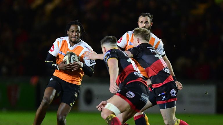 Sibhale Maxwane tackled by Dragons' Arwel Robson and Connor Edwards.