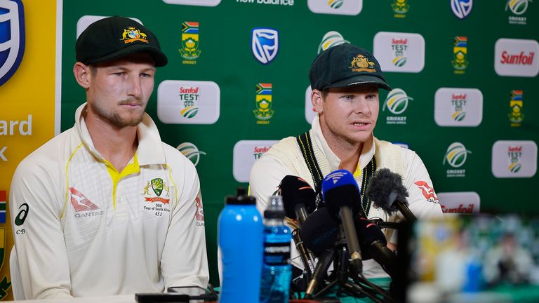 Steve Smith (R) and Cameron Bancroft speak at a press conference during day three of the third test between South Africa and Australia at PPC Newlands on March 24, 2018