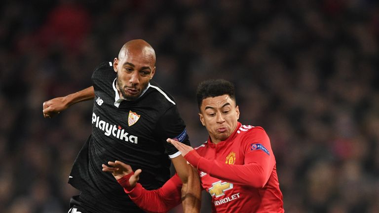 Steven N'Zonzi battles with Jesse Lingard during the UEFA Champions League Round of 16 Second Leg match between Manchester United and Sevilla FC at Old Trafford 