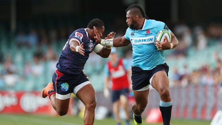 Taqele Naiyaravoro of the Waratahs evades a tackle against the Rebels.