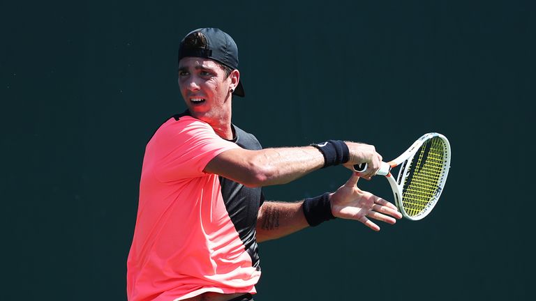 Thanasi Kokkinakis of Australia plays a shot against Daniel Taro of Japan during Day 2 of the Miami Open at the Crandon Park Tennis Center on March 19, 2018 in Key Biscayne, Florida