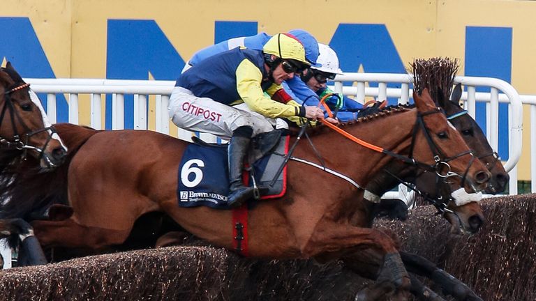 Davy Russell riding The Storyteller (yellow sleeves) clear the last to win The Brown Advisory & Merriebelle Stable Plate Handicap Chase at Cheltenham 