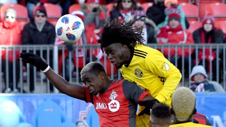 Mar 3, 2018; Toronto, Ontario, CAN; Columbus Crew defender Lalas Abubakar (17) heads the ball away from Toronto FC defender Chris Mavinga (23) in the second half  at BMO Field. Mandatory Credit: Dan Hamilton-USA TODAY Sports