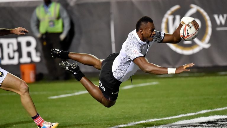 Sevuloni Mocenacagi of Fiji dives for a try against France during the USA Sevens Rugby tournament