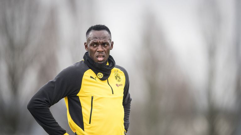 Usain Bolt catches his breath during a training with Borussia Dortmund on March 23, 2018