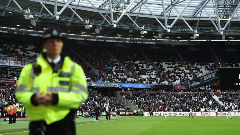 Security on the pitch during the Premier League match at the London Stadium.