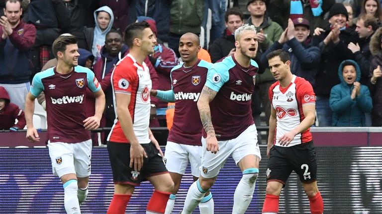 West Ham United's Marko Arnautovic (right) celebrates scoring his side's second goal of the game during the Premier League match at the London Stadium