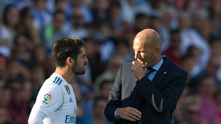 Isco chats with manager Zinedine Zidane 