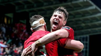Munster's Dan Goggin celebrates his try in South Africa with Conor Oliver