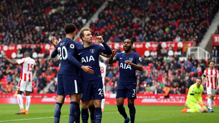Tottenham Hotspur's Christian Eriksen celebrates scoring his side's first goal of the game with his team-mates during the Premier League match at the bet365 Stadium, Stoke. 