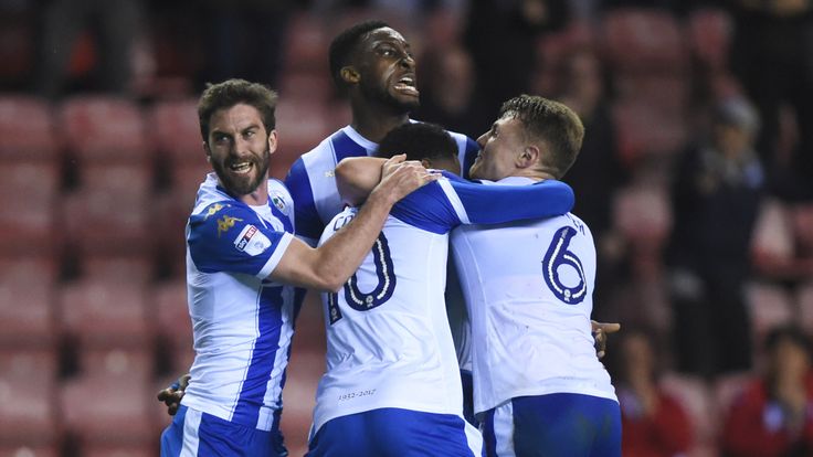 Will Grigg of Wigan Athletic celebrates with his team mates DW Stadium on April 17, 2018 in Wigan, England. (Photo by Nathan Stirk/Getty Images)