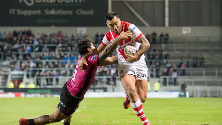 Hull FC's Albert Kelly is unable to prevent St Helens's Zeb Taia from scoring his second try.