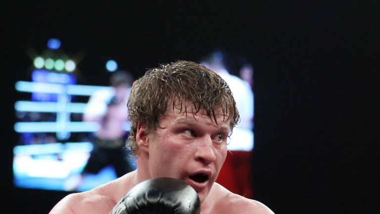 Nicolai Firtha (L) of U.S. and Alexander Povetkin (R) of Russia exchange punches during their Heavyweight fight at Max-Schmeling Hall on December 18, 2010 in Berlin, Germany.