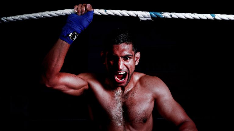 Amir Khan poses during a photo shoot at Gloves Gym on April 22, 2013 in Bolton, England. *** Local Caption *** Amir Khan