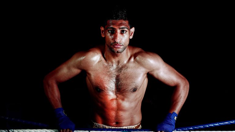 Amir Khan poses during a photo shoot at Gloves Gym on April 22, 2013 in Bolton, England. *** Local Caption *** Amir Khan