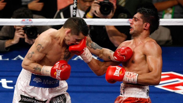 Amir Khan of England connects with a right to the face of Marcos Maidana of Argentina during the WBA super lightweight title fight at Mandalay Bay Events Center