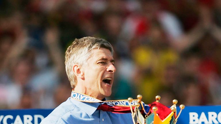 Arsene Wenger lifts the Barclaycard Premiership trophy during the after the match between Arsenal and Leicester City at Highbury on May 15, 2004