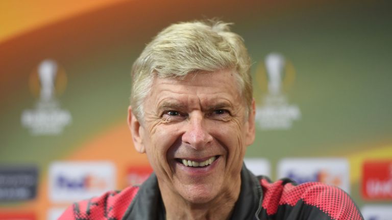 Arsene Wenger smiles during a press conference on the eve of the Europa League semi-final, first leg between Arsenal and Atletico Madrid
