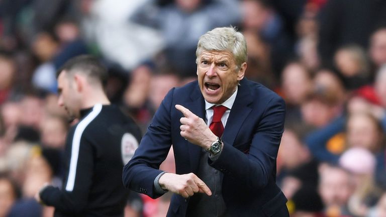 Arsene Wenger shouts instructions from the touchline during the Premier League match between Manchester United and Arsenal at Old Trafford on April 29, 2018