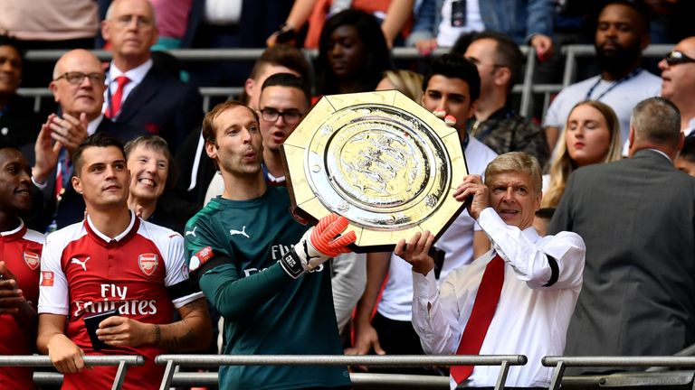 Petr Cech and Arsene Wenger celebrate with the Community Shield after defeating Chelsea 4-1 on penalties at Wembley Stadium on August 6, 2017