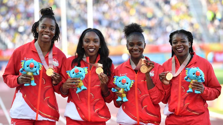 England's (gold) Asha Philip, Dina Asher-Smith, Bianca Williams and Lorraine Ugen pose with their medals after the athletics women's 4x100m relay final during the 2018 Gold Coast Commonwealth Games at the Carrara Stadium on the Gold Coast