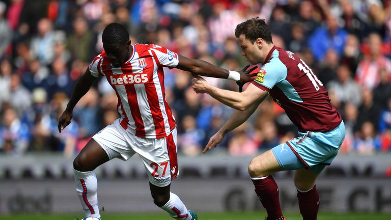 Stoke City's Papa Badou Ndiaye (left) and Burnley's Ashley Barnes battle for the ball