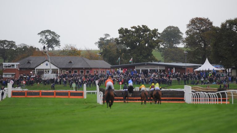 BANGOR, WALES - OCTOBER 31: Horses gallop during The Order Timeform Jumps Horses to Follow Handicap Hurdle Race at Bangor-On-Dee Racecourse on October 31, 2017 in Bangor, Wales. (Photo by Nathan Stirk/Getty Images)