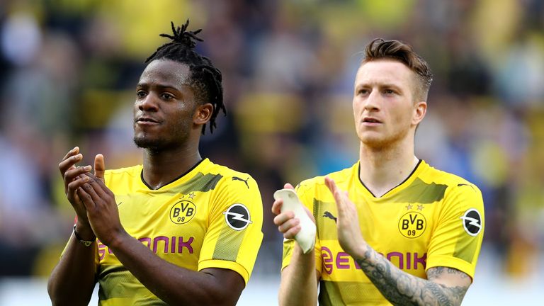 Michy Batshuayi and Marco Reus applaud the fans after Dortmund beat Stuttgart