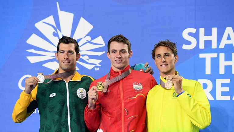 Silver medalist Bradley Tandy of South Africa, gold medalist Ben Proud of England and bronze medalist Cameron McEvoy of Australia pose during the medal ceremony for the Men's 50m Freestyle Final
