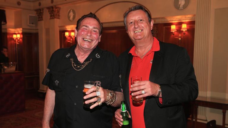 Bobby George and Eric Bristow, both former darts players, are pictured during the Pound 4 Pound Charity fundraiser for Fight4change on May 7, 2014 in London, England