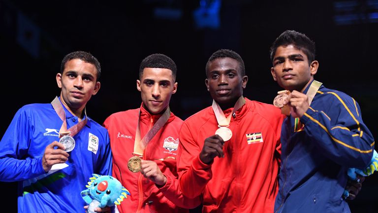 Galal Yafai (second from left) poses with Amit, Juma Miiro and Thiwanka Ranasinghe after winning light-flyweight gold