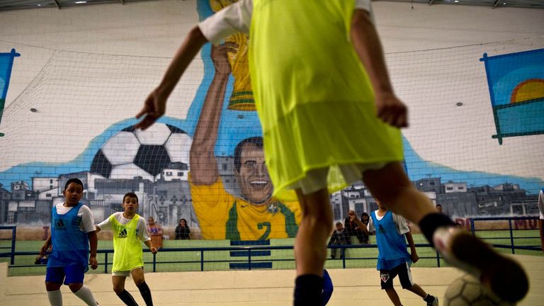 Children playing football in Brazil (provided by Sky News)