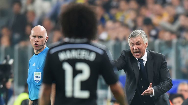Carlo Ancelotti gives instructions to Real Madrid's Marcelo during the UEFA Champions League semi-final, first leg between Juventus and Real Madrid in Turin on May 5, 2015