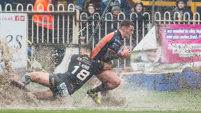 Castleford's Jake Trueman is tackled by Warrington's Toby King
