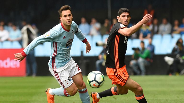 Celta Vigo's Spanish defender Hugo Mallo (L) vies with Valencia's Portuguese midfielder Goncalo Guedes