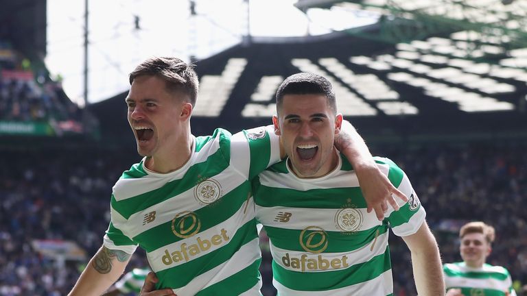 Tomas Rogic celebrates with Mikael Lustig after scoring Celtic's fourth goal against Rangers