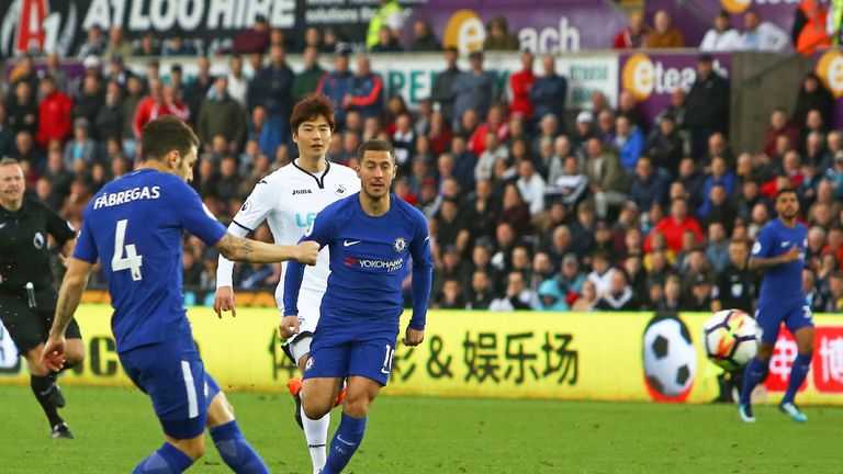 Cesc Fabregas score the opening goal of the Premier League match between Swansea City and Chelsea at The Liberty Stadium