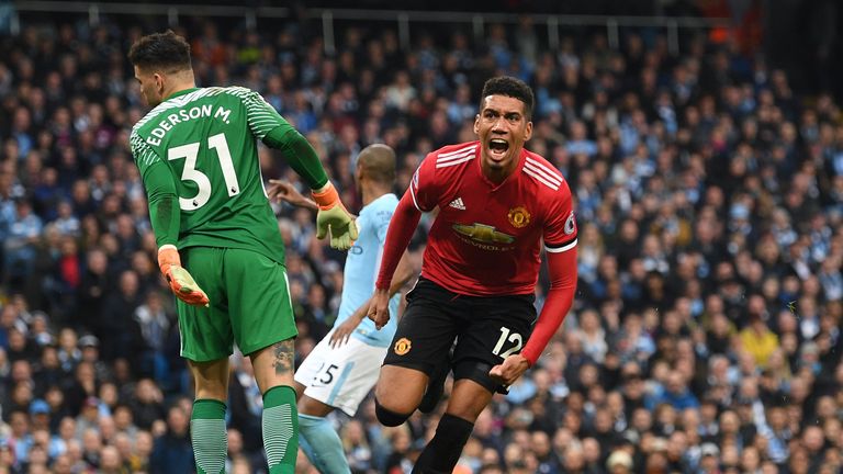 Chris Smalling wheels away from goal after giving Manchester United a 3-2 lead