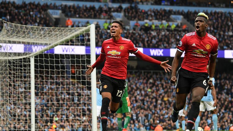 Goal-scorers Chris Smalling and Paul Pogba celebrate Manchester United's third goal