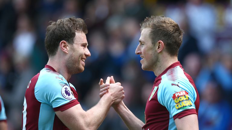 Burnley's Chris Wood (R) celebrates scoring his side's first goal of the game with Ashley Barnes