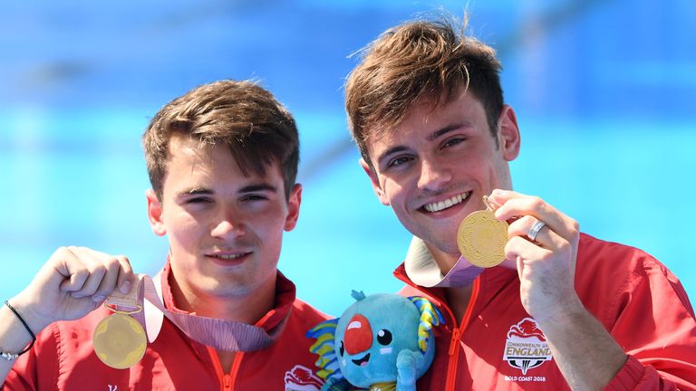 England's Dan Goodfellow and Tom Daley pose with their gold medals in the men's synchronised 10 metre platform diving final