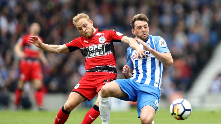 Dale Stephens is challenged by Alex Pritchard during the Premier League match between Brighton & Hove Albion and Huddersfield Town at the Amex Stadium