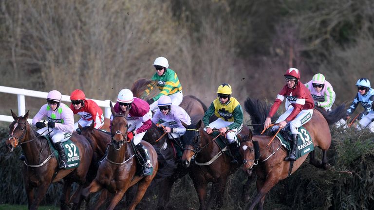 Davy Russell rides Tiger Roll (No 13) over Canal Turn during the 2018 Randox Health Grand National at Aintree Racecourse