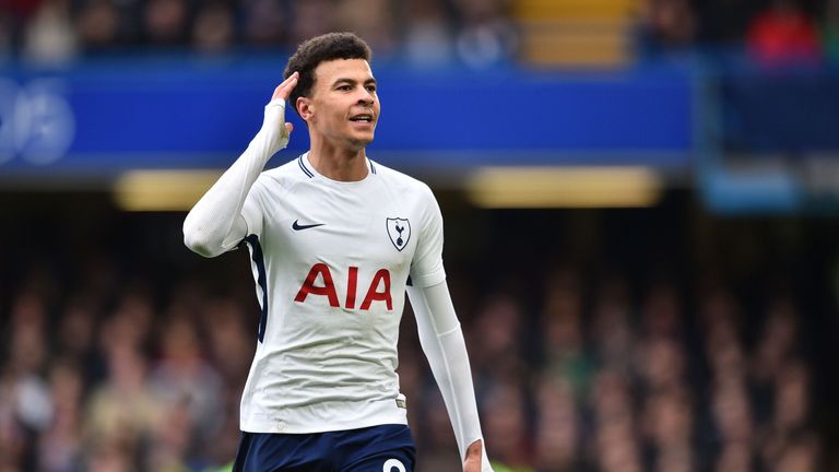 Tottenham Hotspur's English midfielder Dele Alli gestures to the Chelsea fans after scoring their second goal during the English Premier League football match between Chelsea and Tottenham Hotspur at Stamford Bridge in London on April 1, 2018. Tottenham won the game 3-1