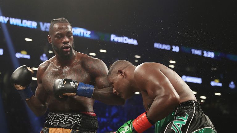 Deontay Wilder punches Luis Ortiz during their WBC Heavyweight Championship fight